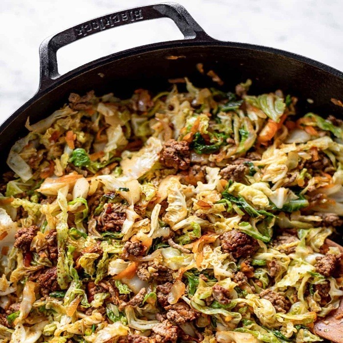 Unstuffed cabbage roll casserole with ground beef, rice, and tomato sauce