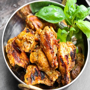 Crispy bone-in air fryer chicken thighs with browned, seasoned skin