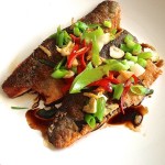 Sea bass with sizzled ginger, chilli & spring onions